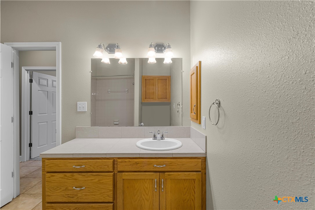 233 Post Oak Bend Inez, TX 77968 - Photo 29 of 45 a bathroom with a sink and a mirror