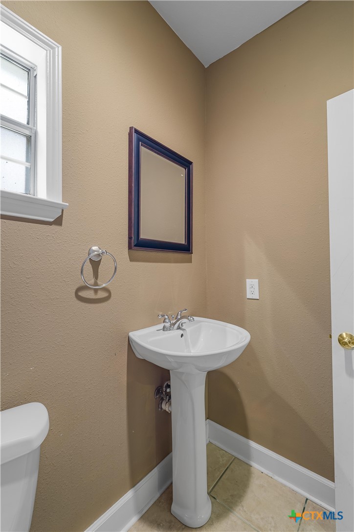 233 Post Oak Bend Inez, TX 77968 - Photo 30 of 45 a bathroom with a sink and a toilet