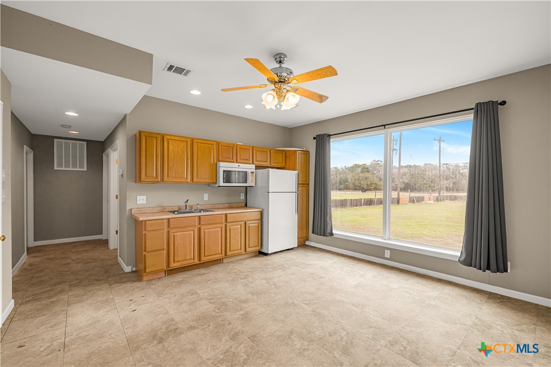 233 Post Oak Bend Inez, TX 77968 - Photo 39 of 45 a view of a kitchen with a sink and a large window