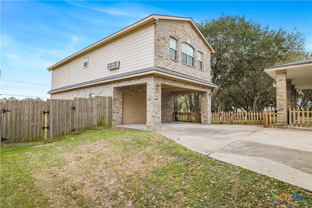 233 Post Oak Bend Inez, TX 77968 - Photo 4 of 45 a view of a house with a backyard
