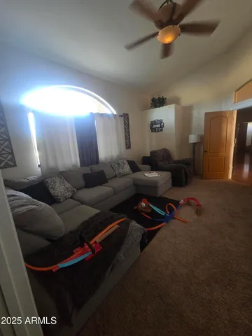 a living room with furniture and a rug