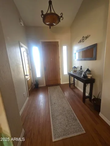a view of a livingroom with furniture and wooden floor