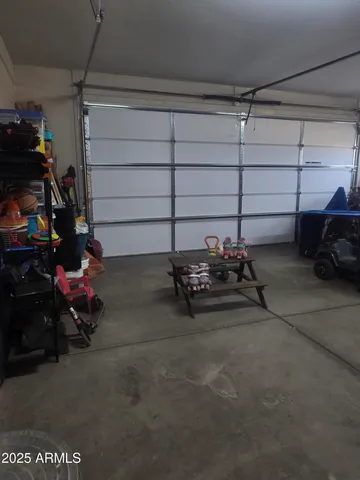 a view of a garage with parked cars