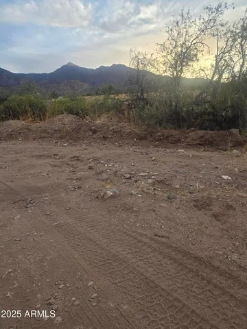 a view of mountain with sunset view