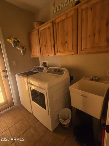 a utility room with dryer and washer