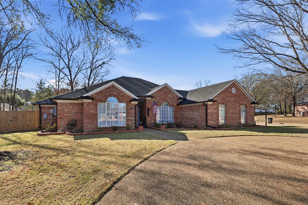 105 Cheyenne Trail Gilmer, TX 75644 - Photo 1 of 35 a front view of a house with a yard covered in snow