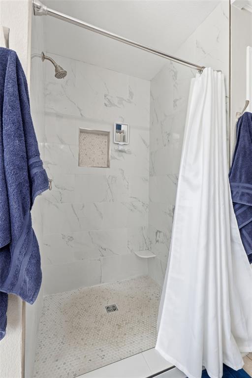 105 Cheyenne Trail Gilmer, TX 75644 - Photo 13 of 35 a bathroom with a shower