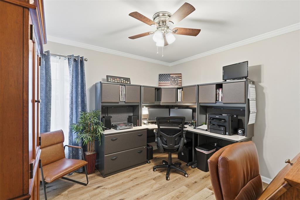 105 Cheyenne Trail Gilmer, TX 75644 - Photo 14 of 35 a view of a workspace with furniture and a potted plant