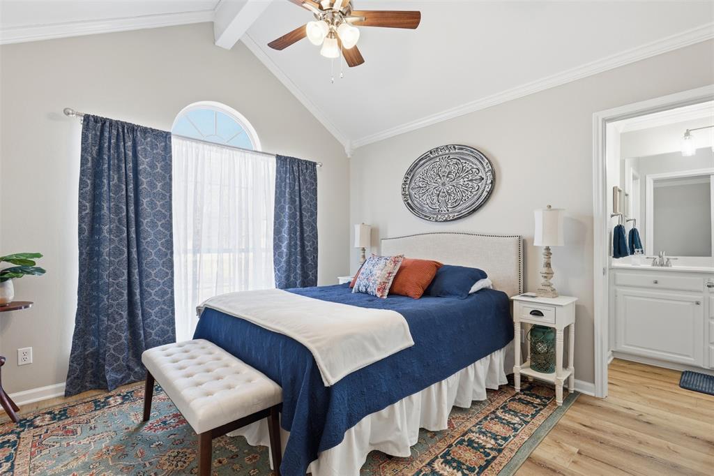 105 Cheyenne Trail Gilmer, TX 75644 - Photo 15 of 35 a bedroom with bed and a chandelier