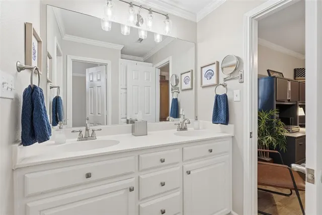 a bathroom with a double vanity sink and a mirror