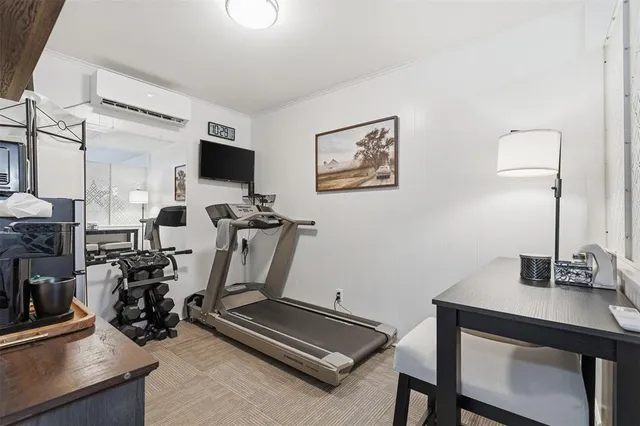 a room with furniture and gym equipment