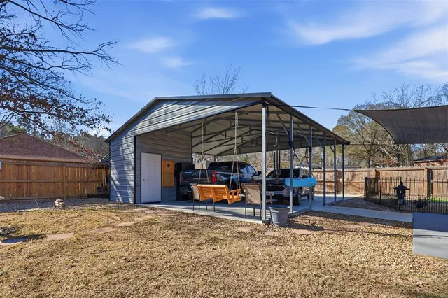a view of a house with backyard and porch