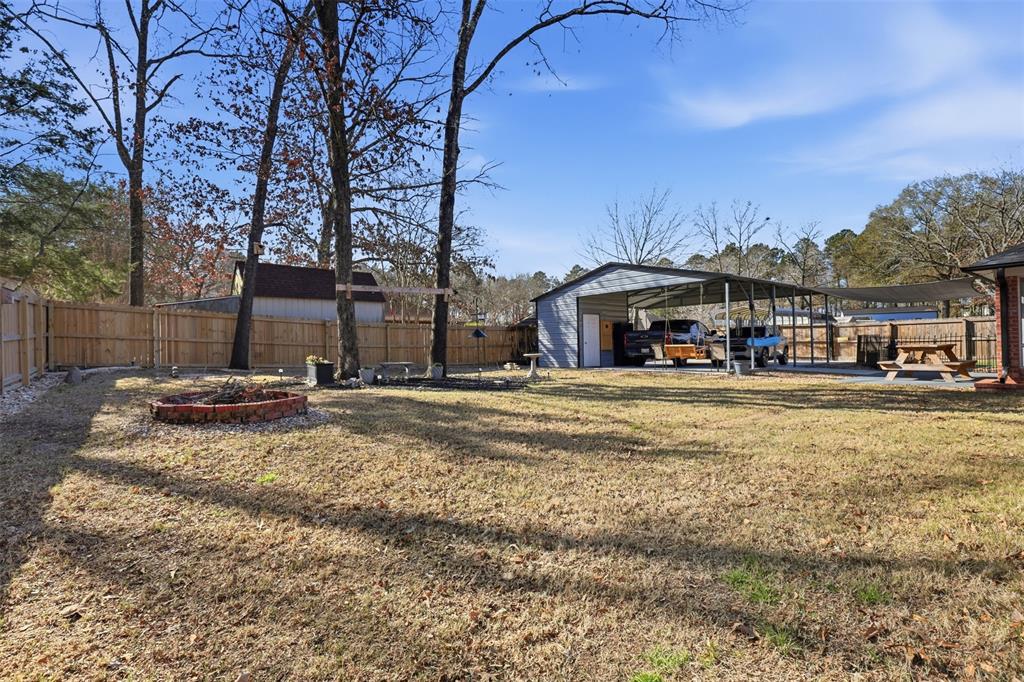 105 Cheyenne Trail Gilmer, TX 75644 - Photo 28 of 35 a view of swimming pool with outdoor seating and house in the background