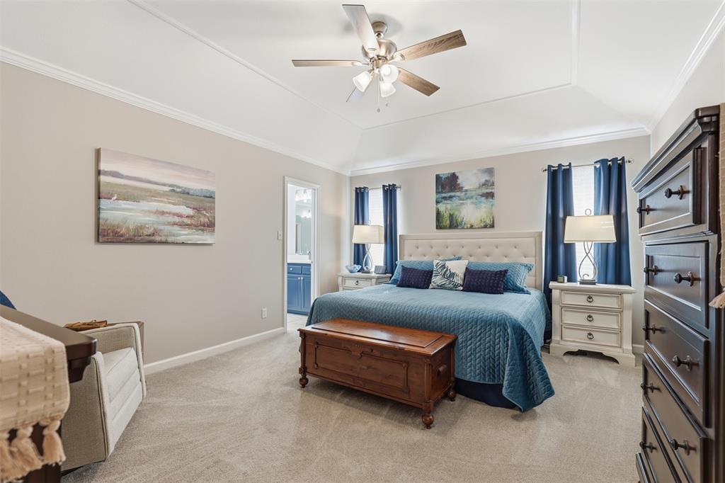 105 Cheyenne Trail Gilmer, TX 75644 - Photo 9 of 35 a bedroom with a bed a couch and a chandelier