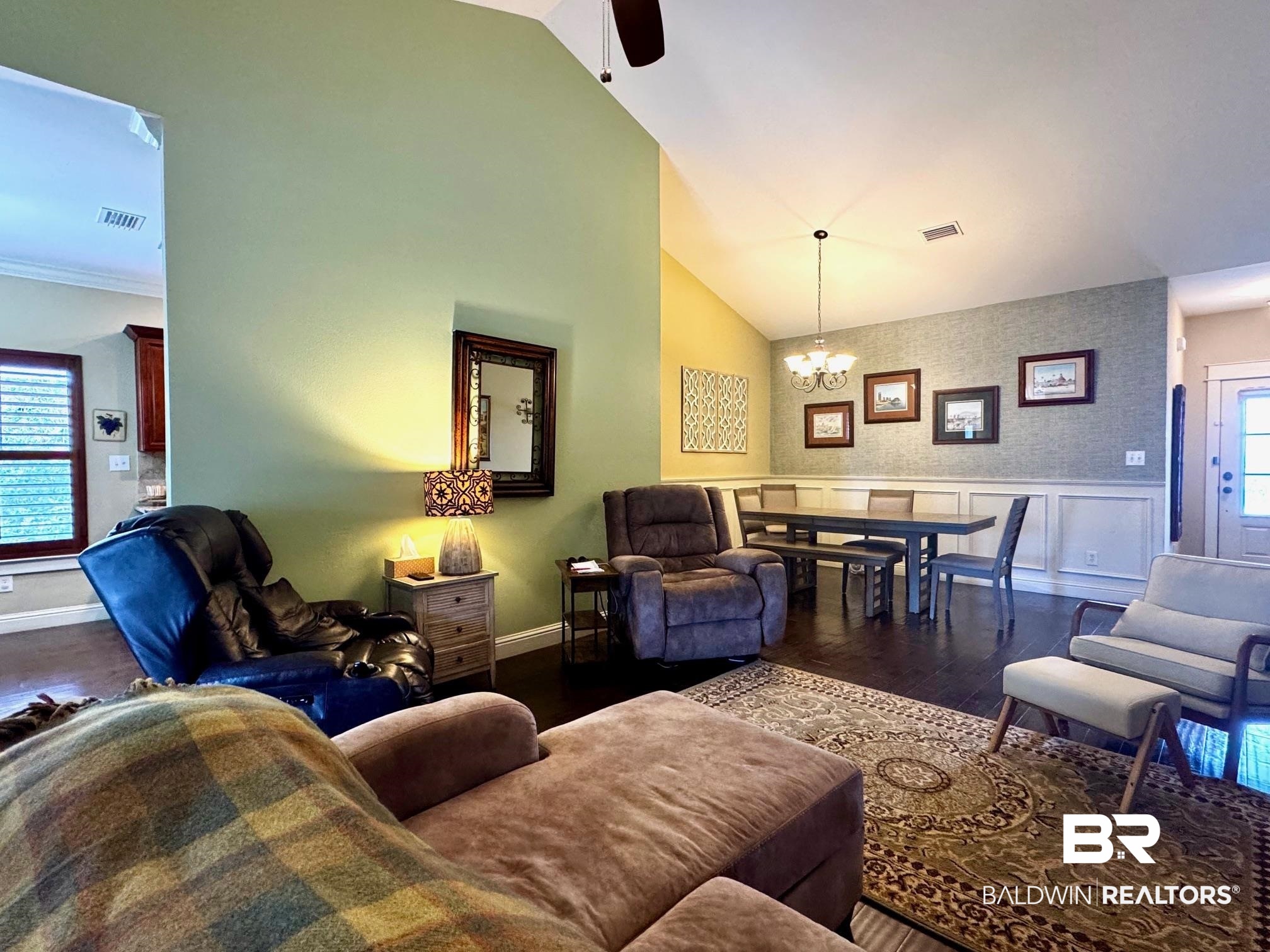 1030 Crown Walk Drive Foley, AL 36535 - Photo 4 of 40 Living room with dark wood-style floors, visible vents, and a wealth of natural light
