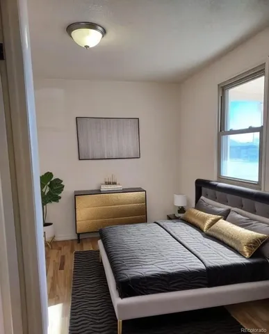 a bedroom with a bed and window