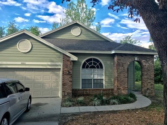 2801 Ripton Court Orlando, FL 32835 - Photo 1 of 1 a front view of a house with garden