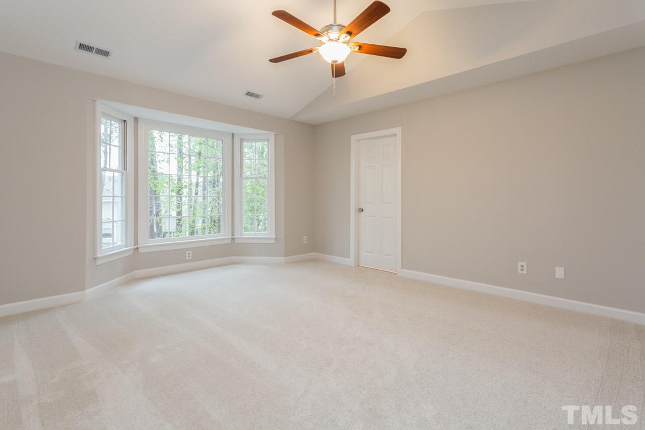 5505 Raddington Street Raleigh, NC 27613 - Photo 11 of 25 a view of a livingroom with a ceiling fan and window