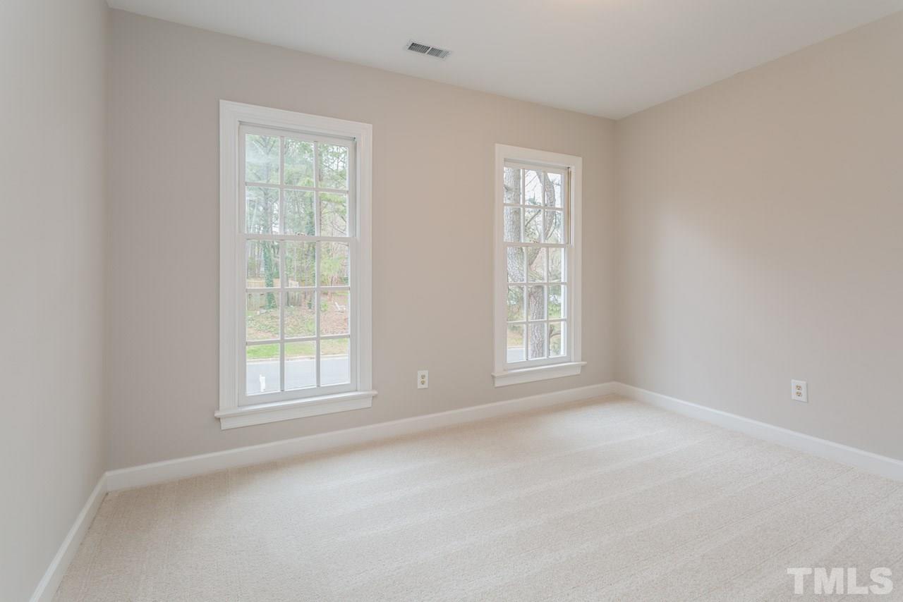 5505 Raddington Street Raleigh, NC 27613 - Photo 17 of 25 an empty room with windows