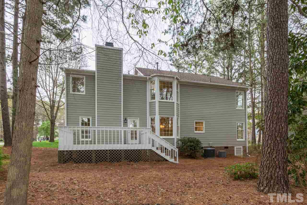 5505 Raddington Street Raleigh, NC 27613 - Photo 22 of 25 a front view of a house with a yard