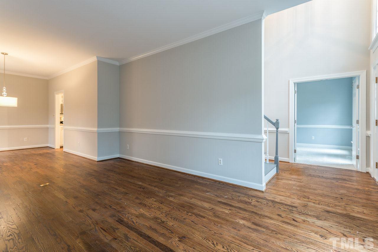 5505 Raddington Street Raleigh, NC 27613 - Photo 9 of 25 a view of an empty room with wooden floor and closet