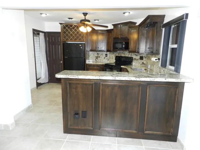 a view of a kitchen with a sink