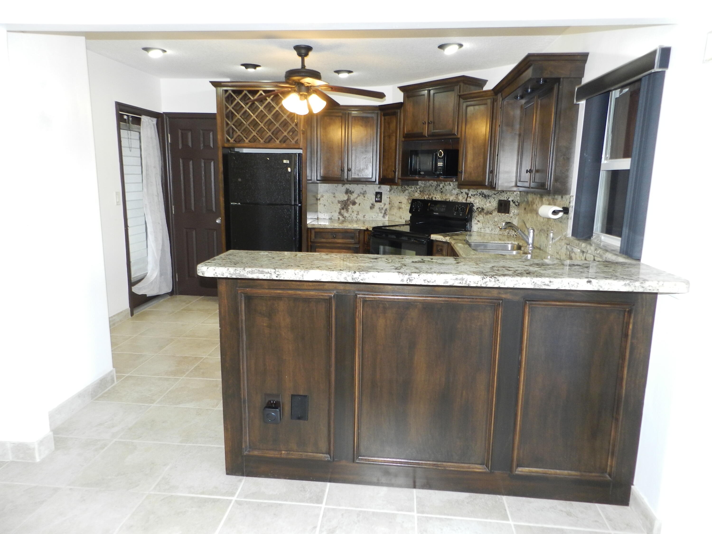 a view of a kitchen with a sink