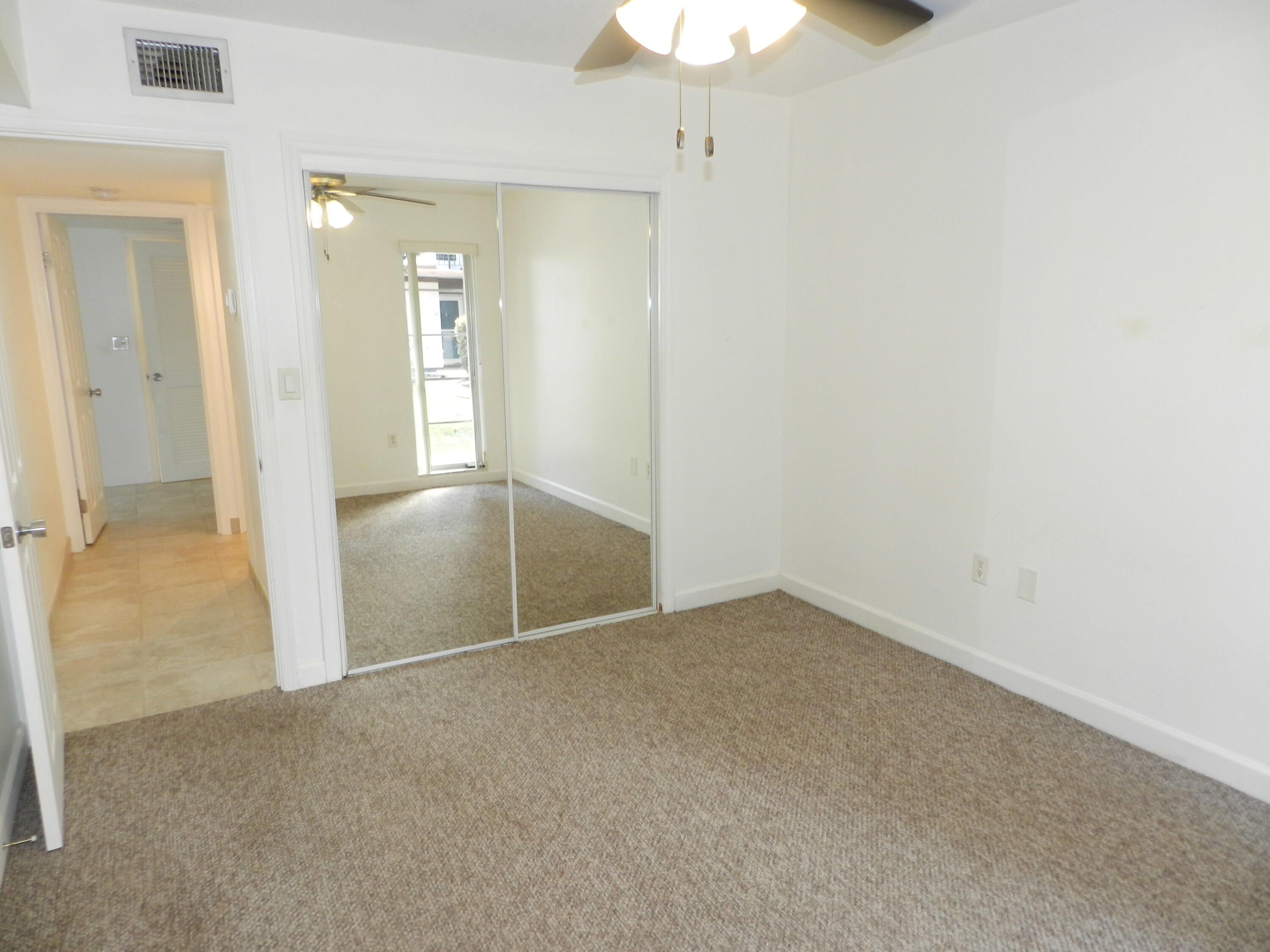3 Greenway Village North, Unit 108 Royal Palm Beach, FL 33411 - Photo 13 of 29 an empty room with a bathroom