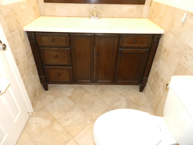 a bathroom with a sink and vanity