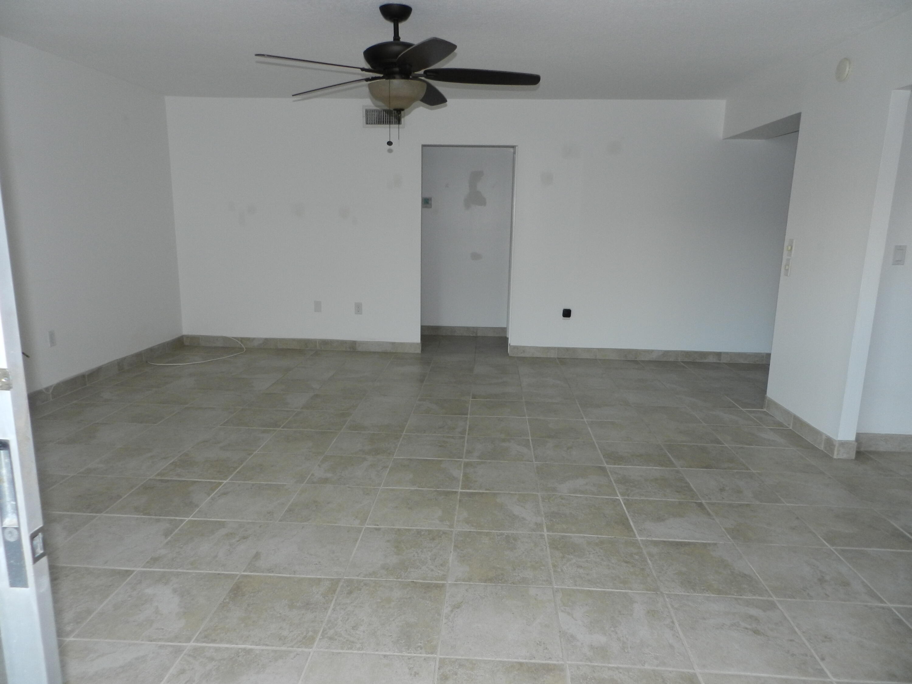 3 Greenway Village North, Unit 108 Royal Palm Beach, FL 33411 - Photo 19 of 29 a view of an empty room