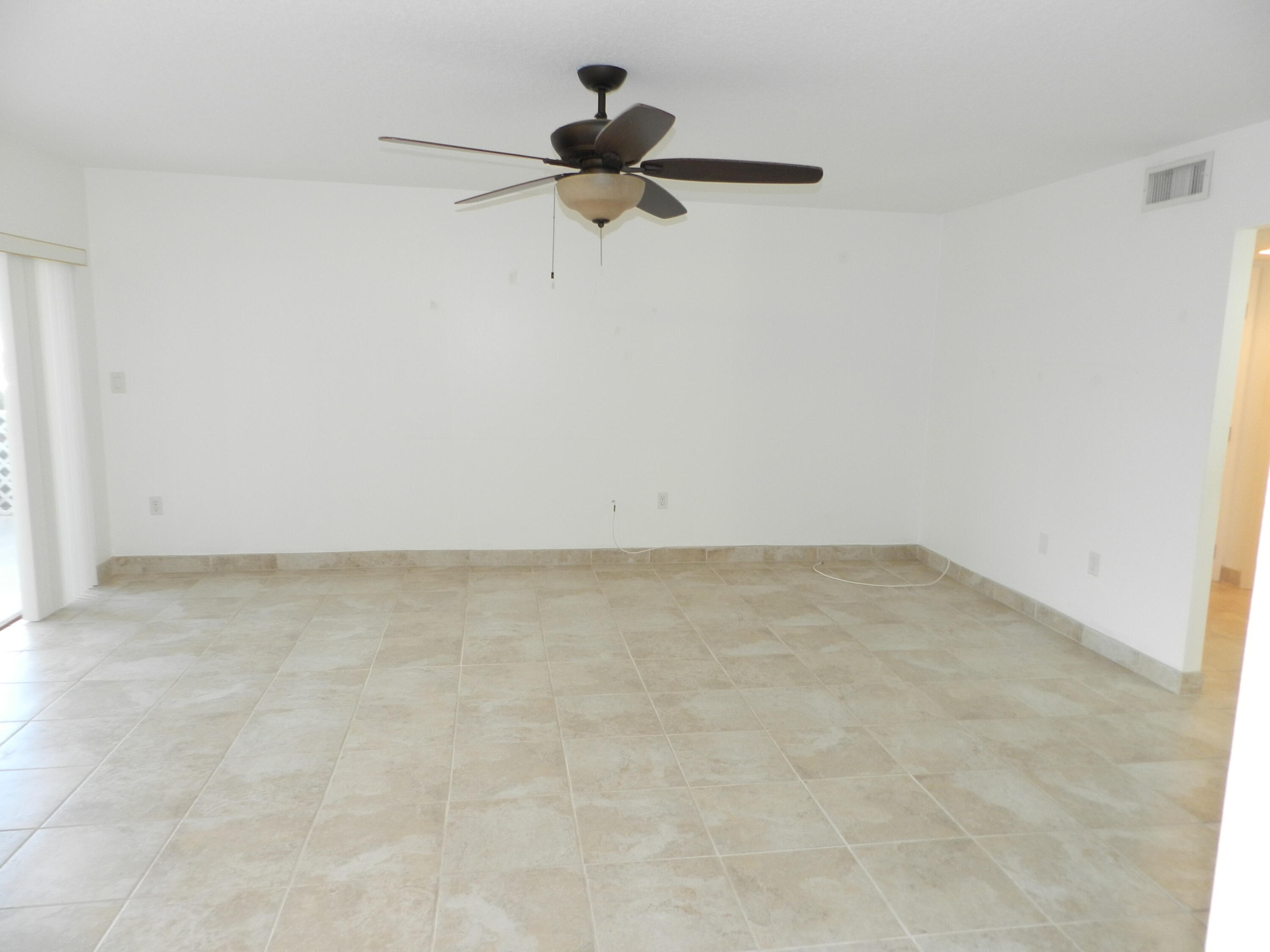 3 Greenway Village North, Unit 108 Royal Palm Beach, FL 33411 - Photo 6 of 29 a view of empty room