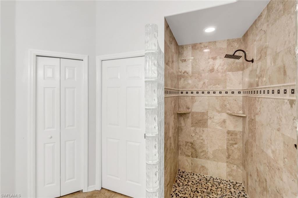 12694 Fox Ridge Drive Bonita Springs, FL 34135 - Photo 18 of 35 a bathroom with a shower