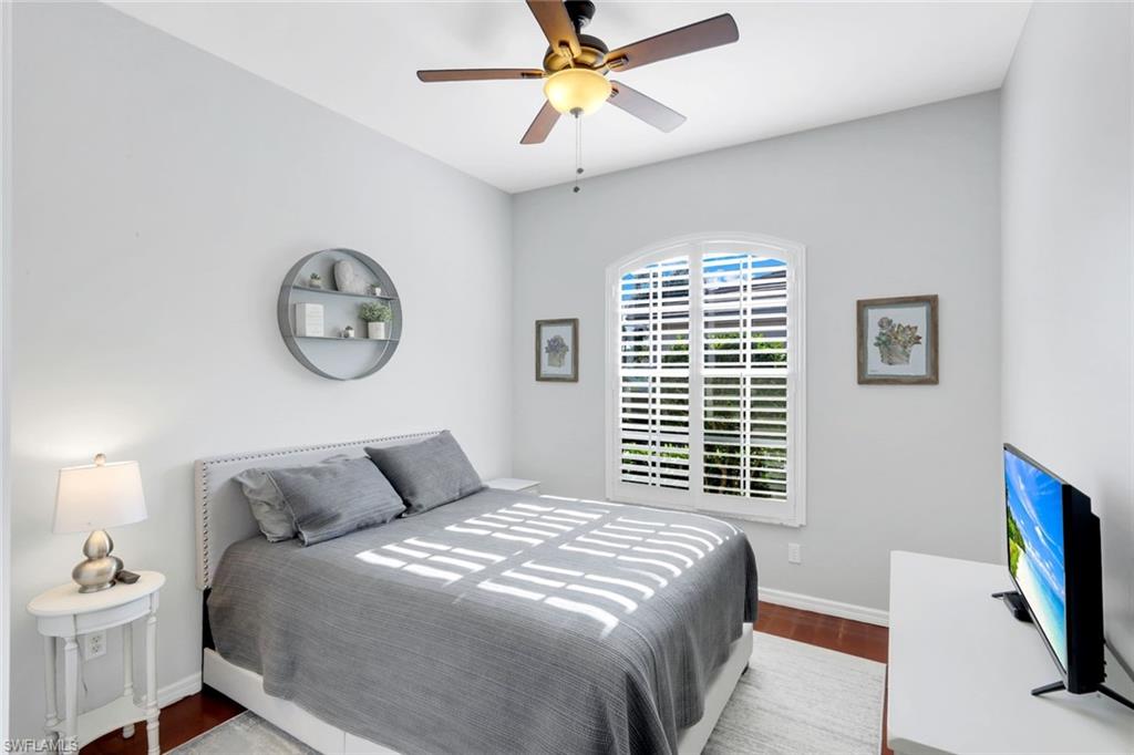 12694 Fox Ridge Drive Bonita Springs, FL 34135 - Photo 21 of 35 a bedroom with a bed and a window