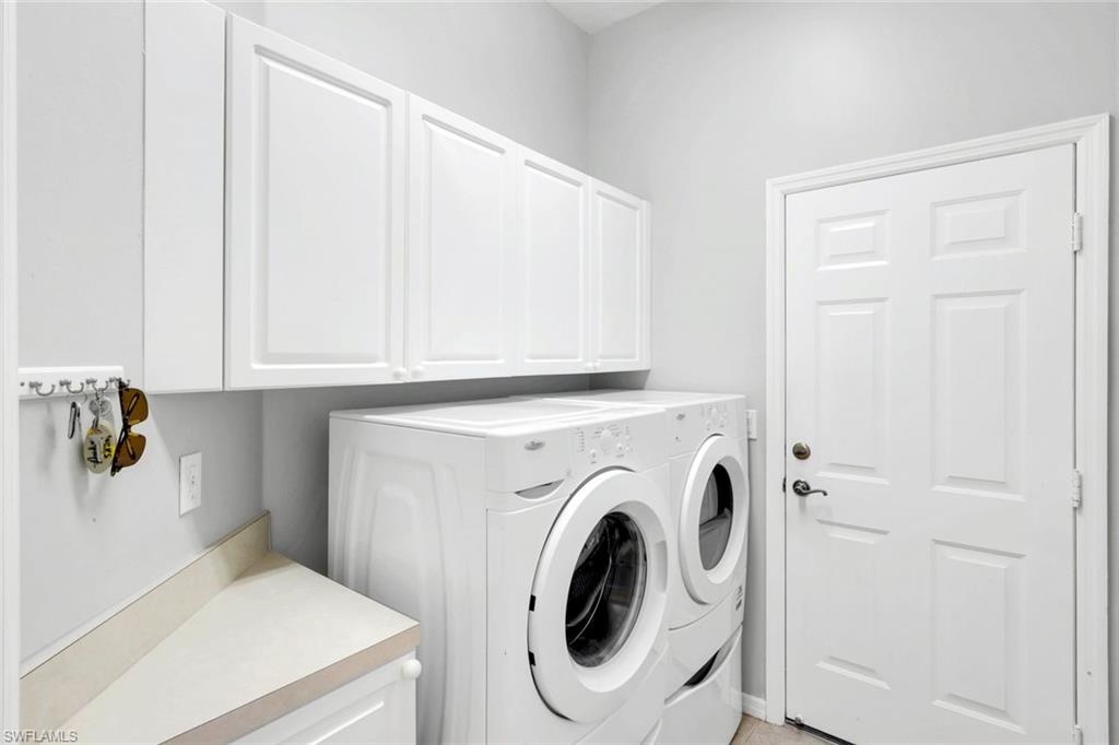 12694 Fox Ridge Drive Bonita Springs, FL 34135 - Photo 24 of 35 a utility room with dryer and washer