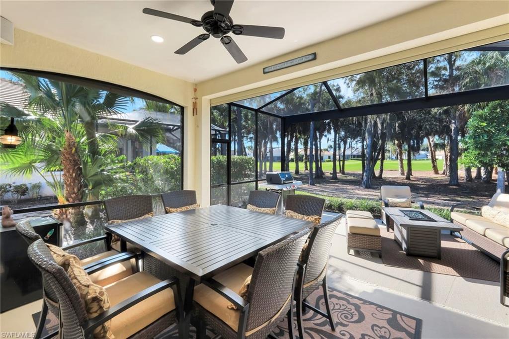 12694 Fox Ridge Drive Bonita Springs, FL 34135 - Photo 26 of 35 a dining room with furniture and a large window