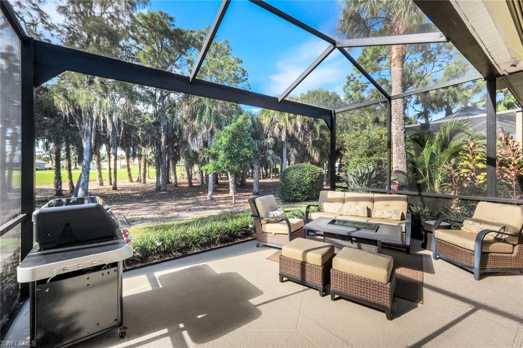 12694 Fox Ridge Drive Bonita Springs, FL 34135 - Photo 28 of 35 a outdoor living space with patio furniture and a potted plant