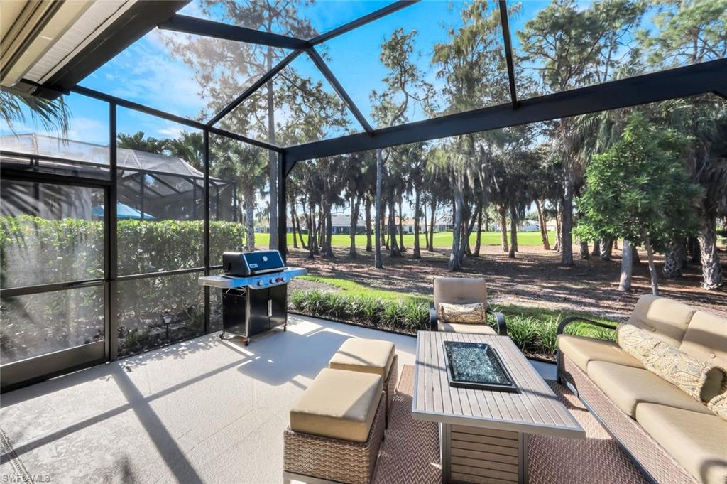 12694 Fox Ridge Drive Bonita Springs, FL 34135 - Photo 29 of 35 a view of a porch with furniture and a yard