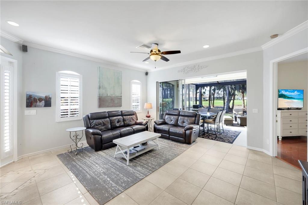 12694 Fox Ridge Drive Bonita Springs, FL 34135 - Photo 4 of 35 a living room with furniture and a large window