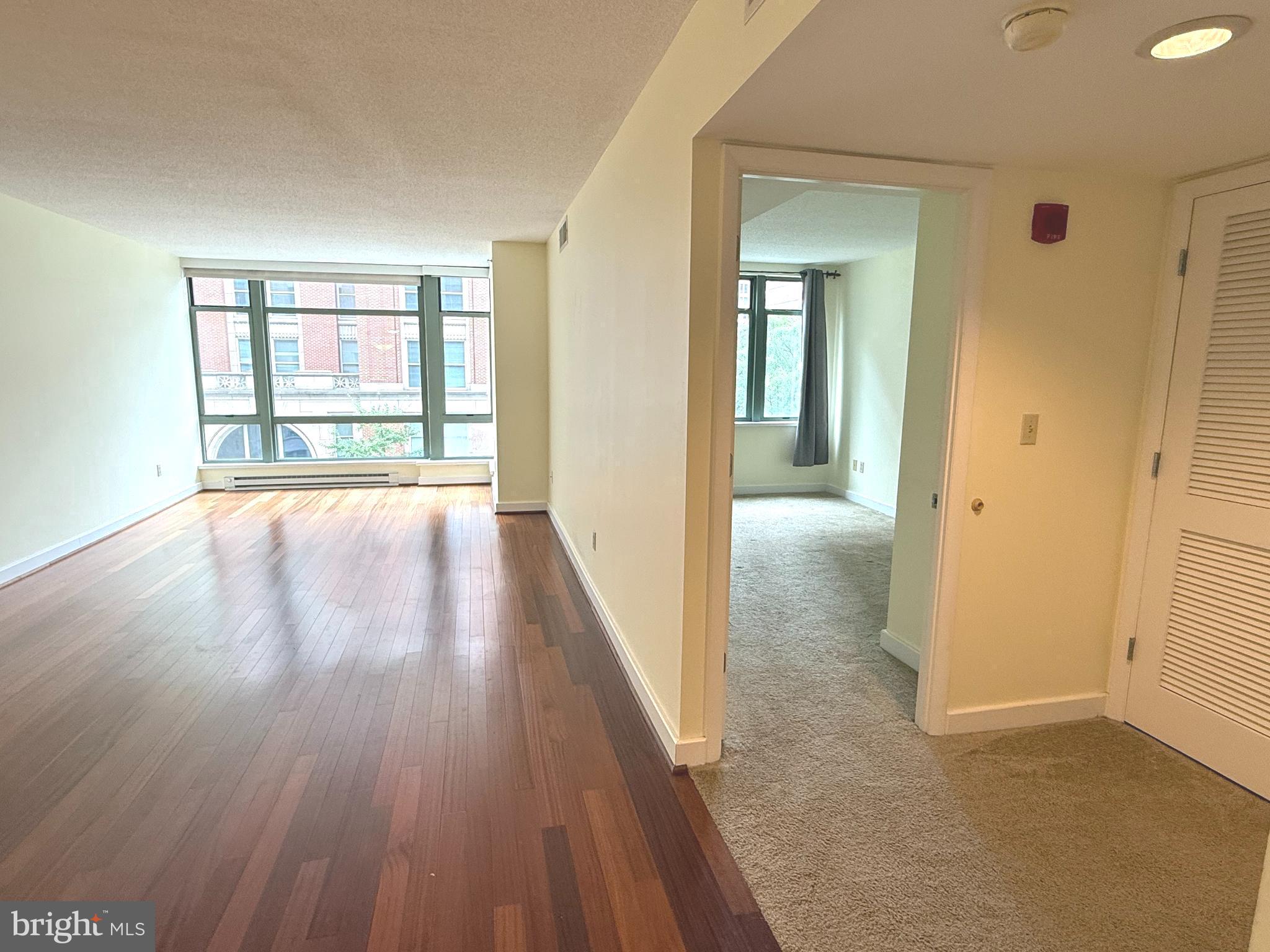 1150 K Street Northwest, Unit 506 Washington, DC 20005 - Photo 6 of 14 wooden floor in a room next to a window