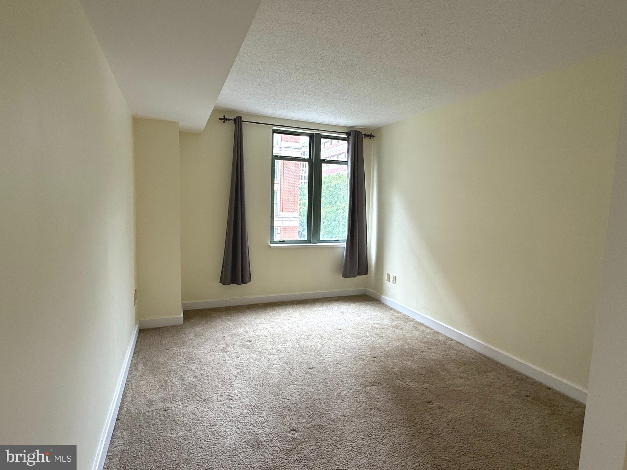 1150 K Street Northwest, Unit 506 Washington, DC 20005 - Photo 7 of 14 an empty room with windows