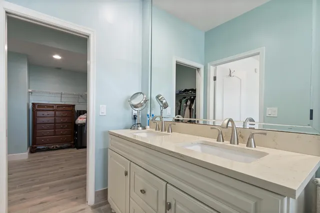 a bathroom with a sink double vanity and a shower