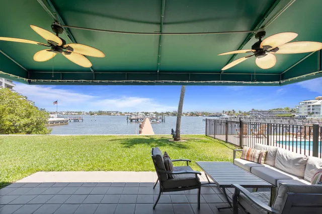 a view of a swimming pool with a patio
