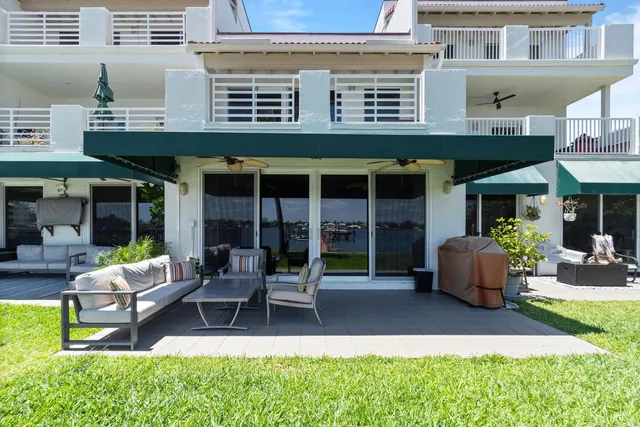 a building outdoor space with patio furniture and potted plants