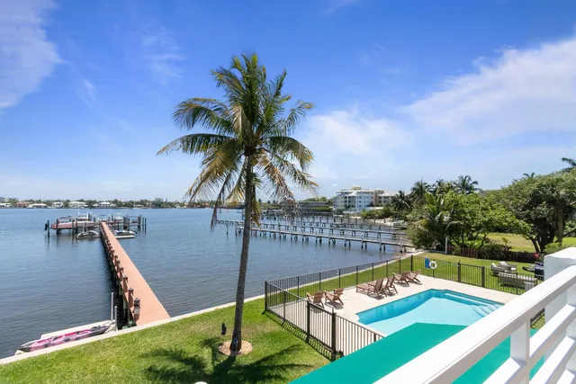 a view of a balcony with floor to ceiling windows
