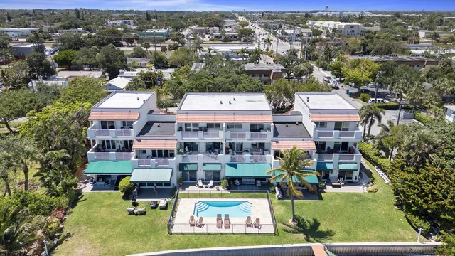 an aerial view of a city with ocean