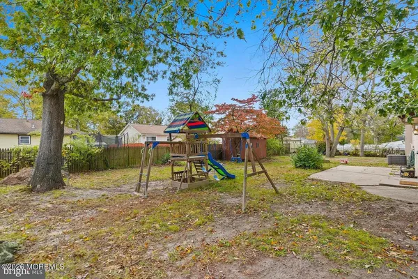a view of outdoor space with playground and green space