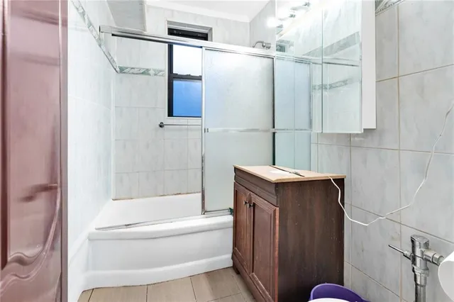a bathroom with a shower and a tub