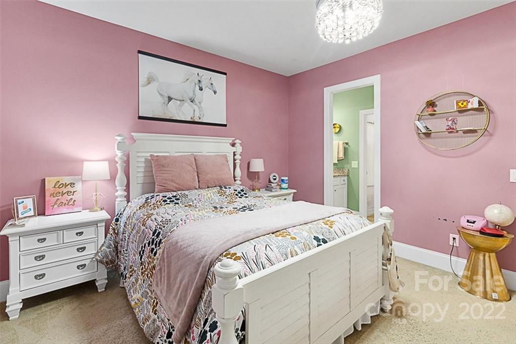 7001 Fallondale Road Waxhaw, NC 28173 - Photo 23 of 32 a bedroom with a bed and a table in it