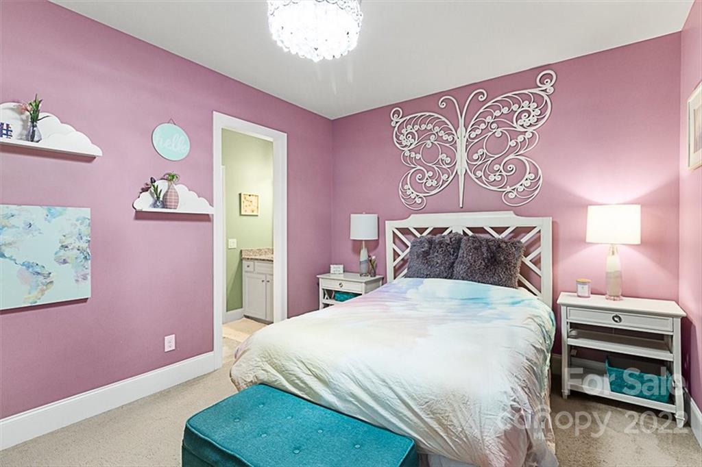 7001 Fallondale Road Waxhaw, NC 28173 - Photo 24 of 32 a bedroom with a bed and a dresser with wooden floor