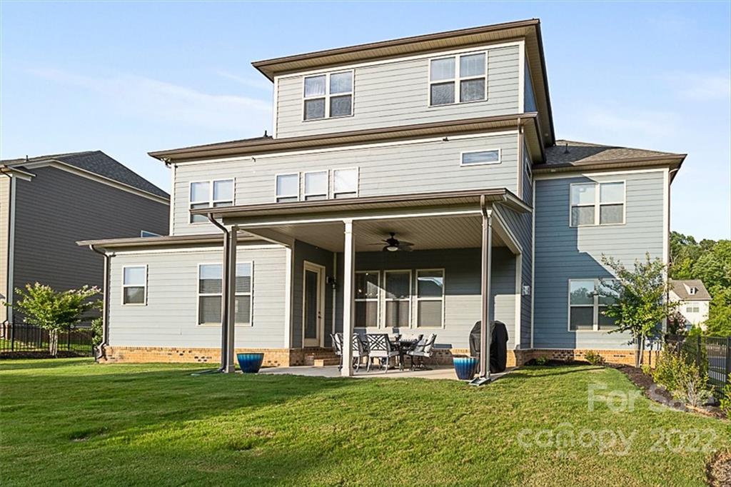 7001 Fallondale Road Waxhaw, NC 28173 - Photo 26 of 32 a view of a house with a yard and sitting area